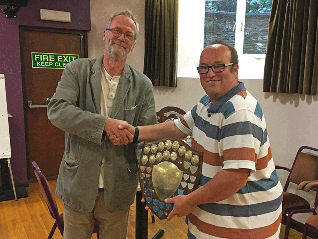 Ben Wilkinson presents the Division 1 trophy to Andrew Kinder representing Newton Abbot.