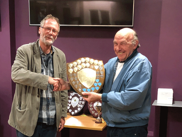 Mike Cuggy presents the Premier Division trophy to Andrew Kinder the Newton Abbot Bishops team captain