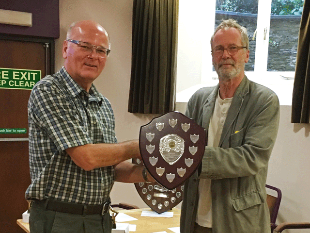 Plymouth won the Division 4 title.  Andrew Kinder presents the Trophy to Tony Tatam.