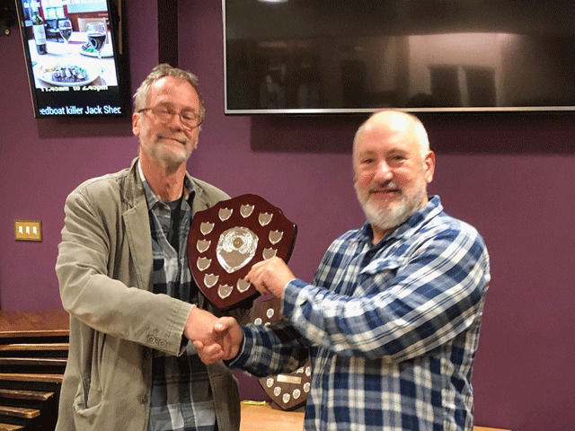 Newton Abbot won the Division 4 title.  Andrew Kinder presents the  trophy to Mike Hussey.