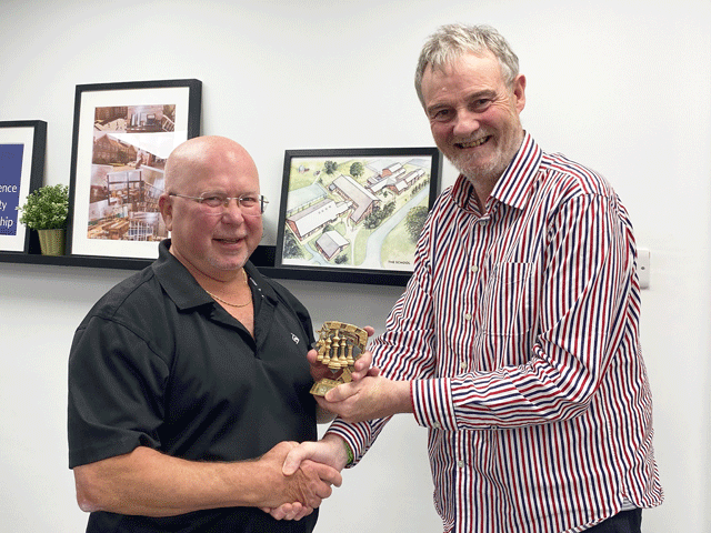 Paul Brooks presented the Division 2 player of the year trophy to Bill Ingham (Teignmouth)